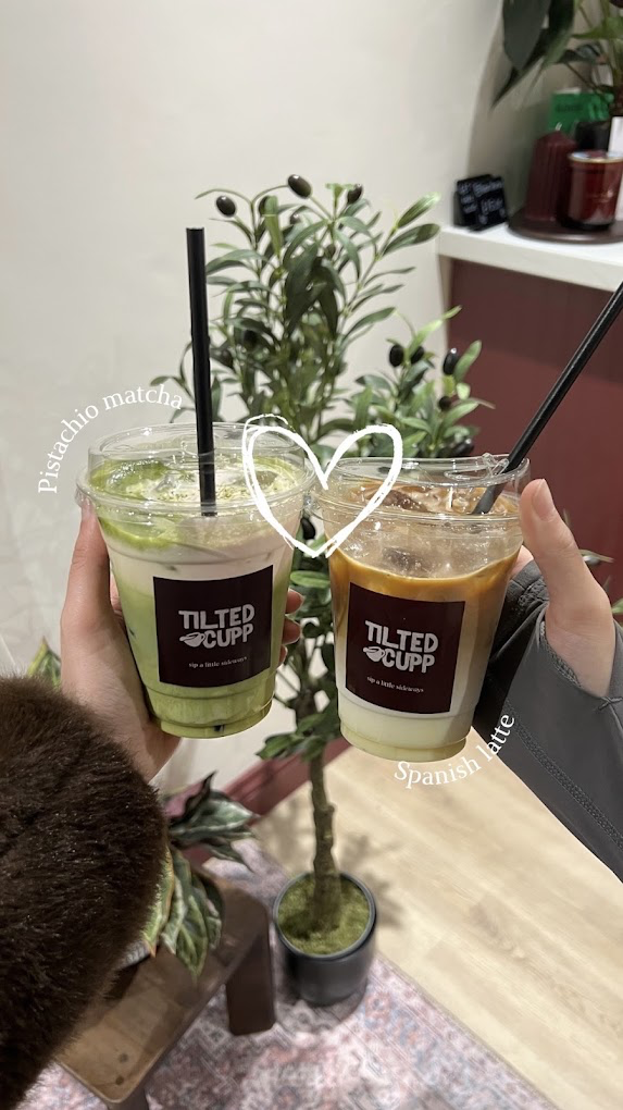 Pistachio matcha and Spanish latte held side by side